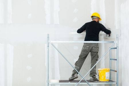 worker-plastering-gypsum-board-wall.jpg